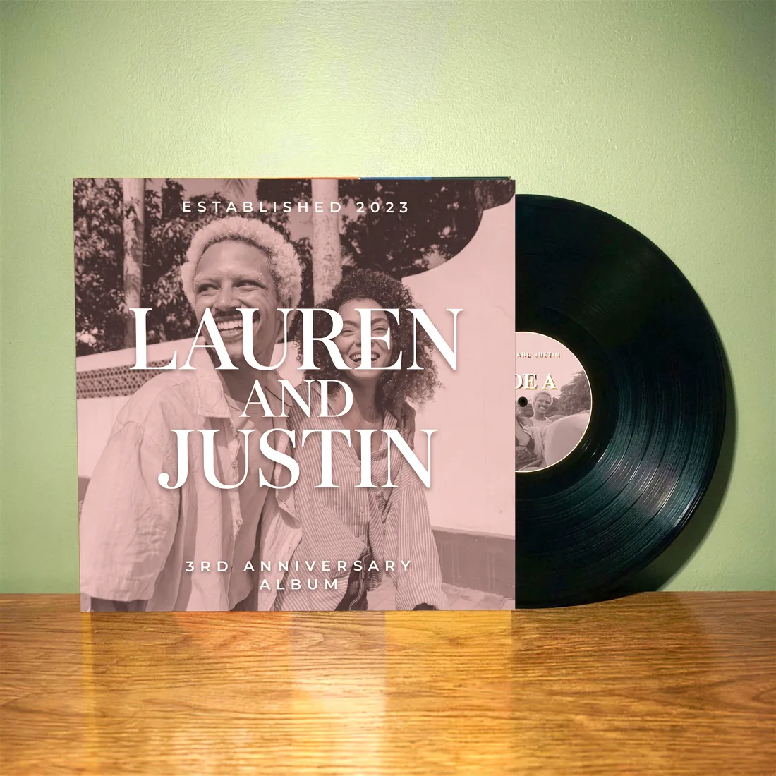 Customer-made custom vinyl record sliding out of its personalized album cover